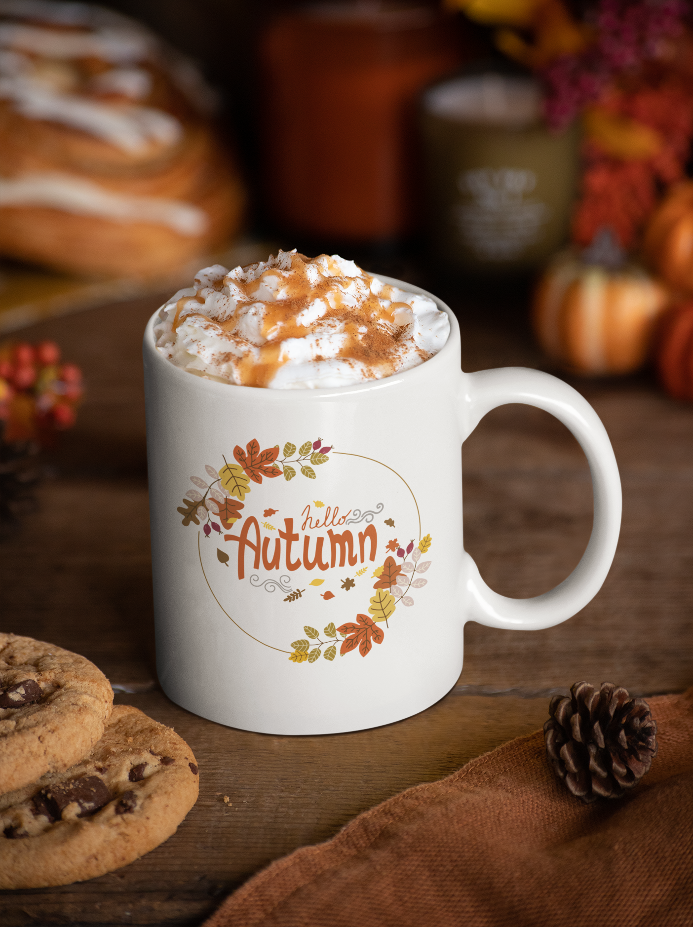 Fall themed mockup with pumpkins in the background of an 11 oz coffee mug that says hello autumn.